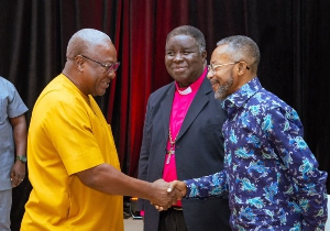 John Mahama,[L] exchanging pleasantries with Rev. Owusu-Bempah at an event