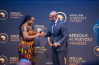 Elsie Appau-Klu Esq receiving the award from Dr. Peter Fashesine-Souza