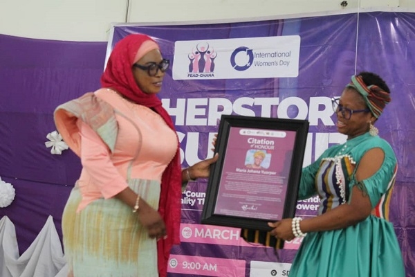 Maria Johana Yuorpor (right) receiving her award