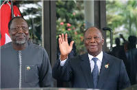 Omar Touray, president of the ECOWAS Commission, left, and Ivory Coast President Alassane Ouattara