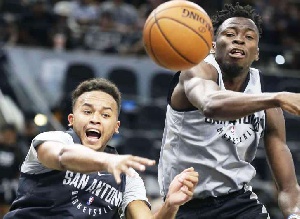 Brimah (right) battles for ball with Kyle Anderson in a team scrimmage