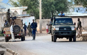 Security personnel patrol a street in Baidoa, Somalia