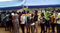 Residents in queues waiting to be registered