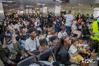 A photo of returnees from SA seated at the Accra International Airport