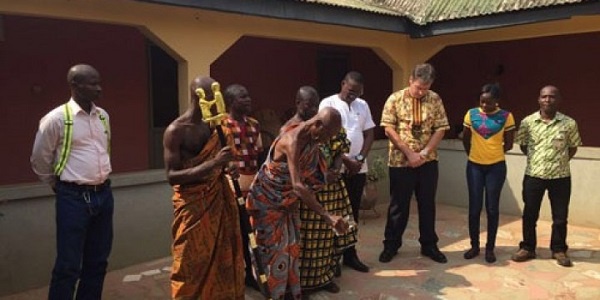 Some elders of Damang pouring libation