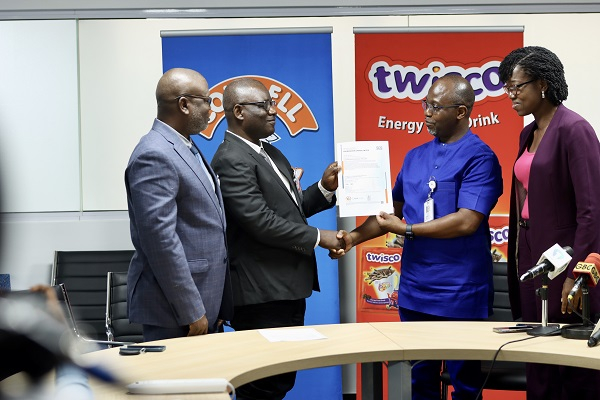 Festus Tettey (Right), Managing Director of Promasidor Ghana receiving the certificate