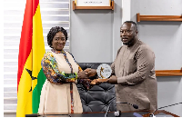 The Vice President receiving a plaque from George Opare Addo