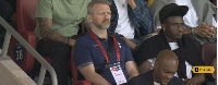 Mohammed Kudus (in a black cap) watches Tottenham's defeat from the stands alongside injured mates