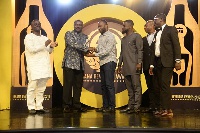 Ahomka-Lindsay presenting the ultimate award to Kasapreko as Mr Boateng looks on