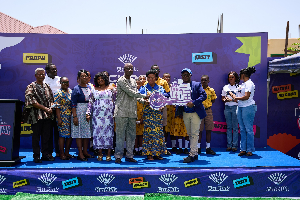 The presentation to the school being done during the event