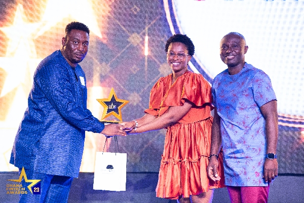 Receiving the awards on behalf of eTranzact Ghana , Yvonne Effe and Mr Paul Otu