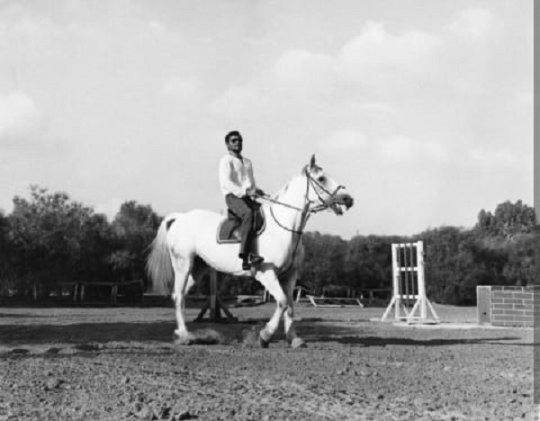 JJ Rawlings is seen here riding Juda, a horse that belonged to Libya's Gaddafi