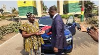 Alhaji Ayana Yakubu (left) receiving the keys to the vehicle from Kofi Okyere Darko