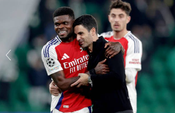 Thomas Partey [L] in a hug with Coach, Mikel Aterta