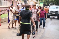 The reporter used her camera to ward off angry supporters of Bishop Obinim who tried to attack her