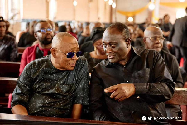 Alhaji Boniface and Alan having a chat at a funeral