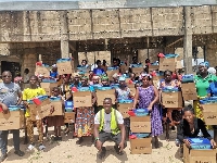 Flood victims receive relief items donated to them by the NGO