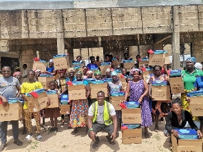 Flood victims receive relief items donated to them by the NGO