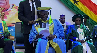 Former president John Agyekum Kufour (holding a white paper)