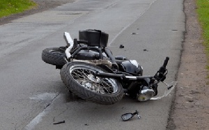 The bus knocked down the motorbike of the teacher, injuring him in the process