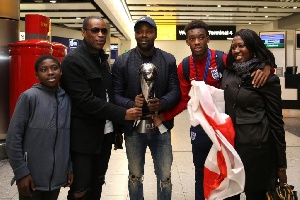 Hudson-Odoi with his family and dad (Bismark) second from left. His mum is first from right