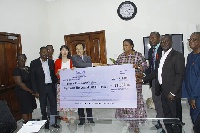 Chinese Ambassador to Ghana, H.E. Shi Ting Wang making the donation to First Lady Rebecca Akufo-Addo