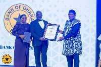 Bernard Otabil and Emelia Awuviri receiving the award on behalf of the bank