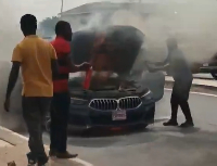 Several people tried to quench the fire as the vehicle was engulfed in flames