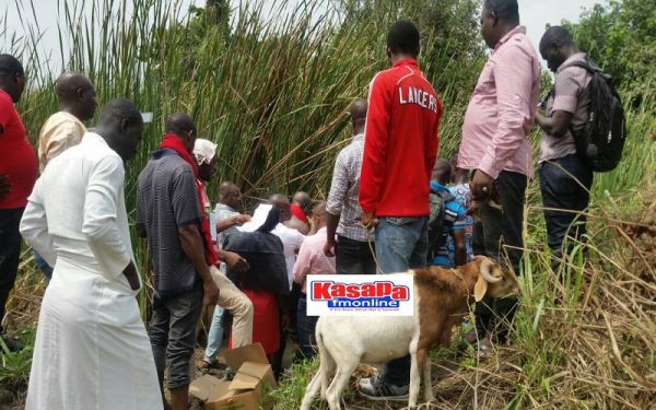 Residents gather at the scene where the alleged curses were cast