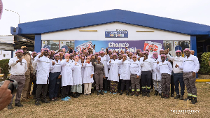 President John Dramani Mahama with workers at the Nestlé Ghana factory in Tema