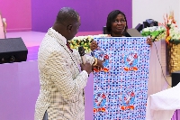 Apostle Henry Ampomah-Boateng unveiling the church cloth