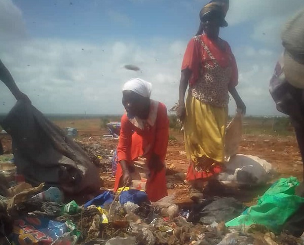 Hafsa on her daily work of scouting for used bottles at a landfill site