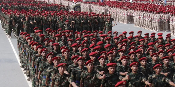 Houthi forces march in the Red Sea port city of Hodeidah