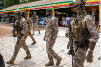 Lieutenant Colonel Assimi Goita, (C), attends an Independence Day military parade in Bamako