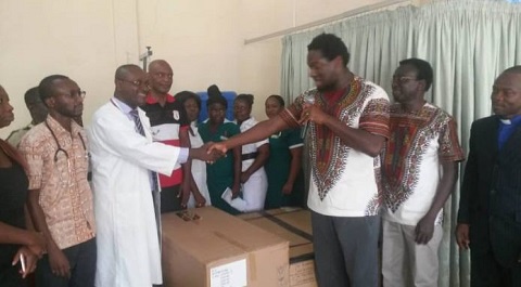 A representative from Asantewaa Boy's Foundation donating the incubators to the hospital