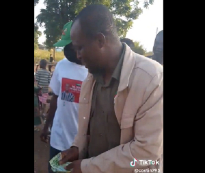 The Man Captured Sharing Money .png