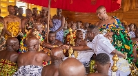CEO of Opportunity International Savings and Loans exchanging pleasantries with Otumfuo Osei Tutu II