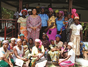 Mrs. Rebecca Akufo-Addo (second from left) in a group photograph with the kayayei