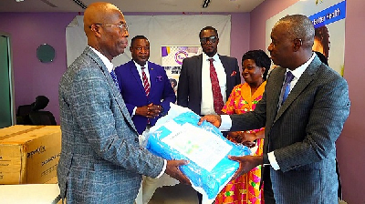 Mr. Andoh (right) presenting a caesarian section pack to Dr. Srofenyoh