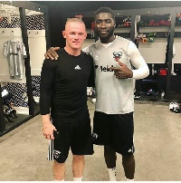 Ghanaian defender Kofi Opare with Wayne Rooney