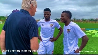Rene Hiddink interacting with some players of Hearts of Oak at Pobiman
