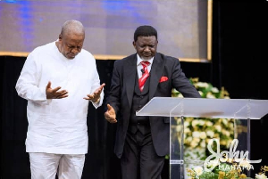 President Mahama [L] and Archbishop Charles Agyinasare