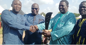 Ali Lukeman (second right) receiving the sword of honour from his predecessor