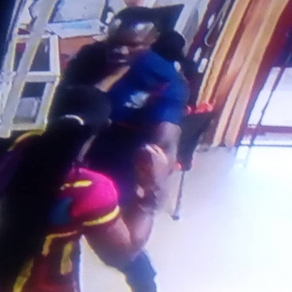 The angry female customer of GN Bank assaulted the police officer on guard duty