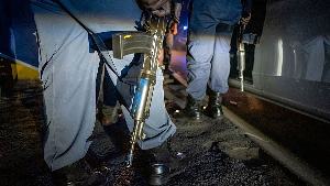 Police patrol an area in Soweto in search of illegal firearms