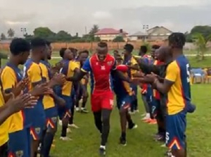 Benjamin Asare (M) received applause from his Hearts of Oak teammates
