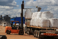 Workers load lithium concentrate at Prospect Lithium Zimbabwe mine