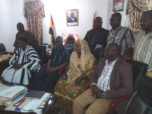 Naa Fuseini Seidu Pelpuo IV (L) with some staff of the Wa Municipal Assembly