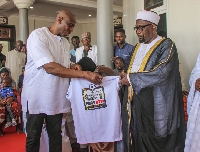 Herbert Mensah presenting a gift to the Chief Imam at the mosque