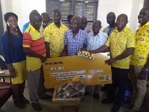 The MTN group handing over the packages to representatives of the Kwahu Traditional Council